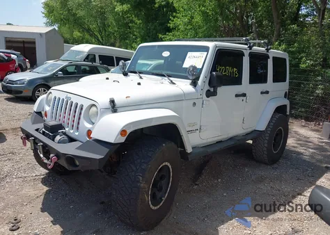 2011 Jeep Wrangler Unlimited Sahara z USA, uszkodzony, nr VIN 1J4HA5H16BL563723